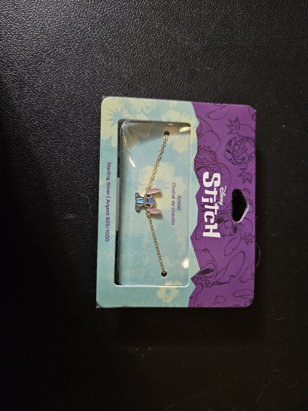 Claire's Gold-Tone Bracelet with Blue & Pink Stitch Charm